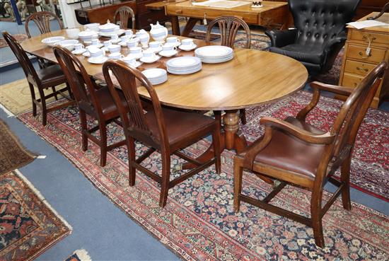 A set of eight Hepplewhite style mahogany dining chairs (2 arm, 5 single), and a Regency style mahogany 2 pillar dining table, chairs a